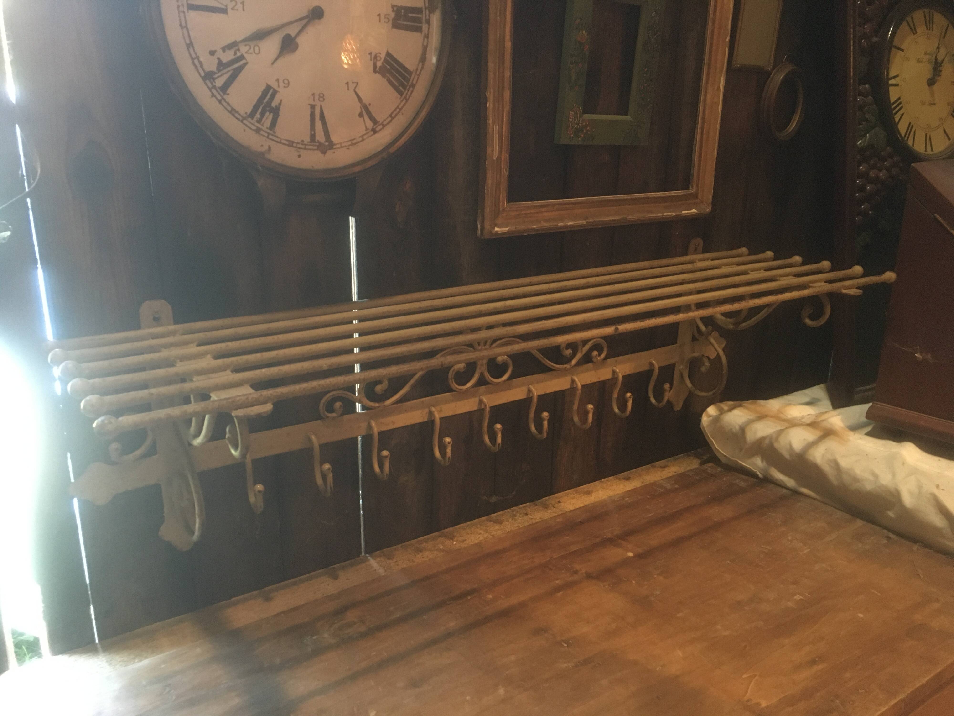 White wrought iron coat and hat rack