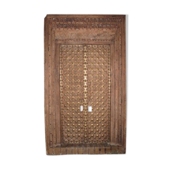 Old crafted teak and brass door