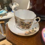 Enameled porcelain cup with saucer