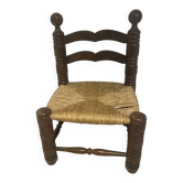 Vintage low chair by Charles Dudouyt in turned wood and straw — 1950s