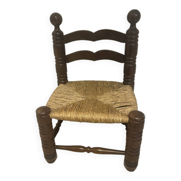 Vintage low chair by Charles Dudouyt in turned wood and straw — 1950s