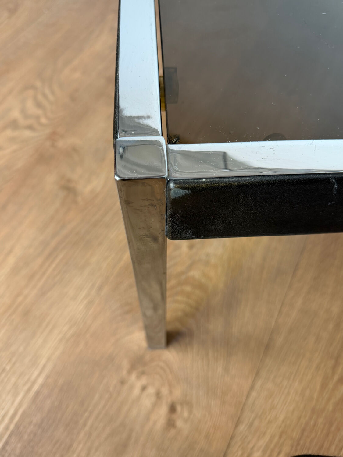 Large designer coffee table from the 70s in chrome, smoked glass, and faux leather.