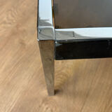 Large designer coffee table from the 70s in chrome, smoked glass, and faux leather.