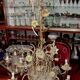 Large floral Art Nouveau chandelier in patinated bronze and metal.