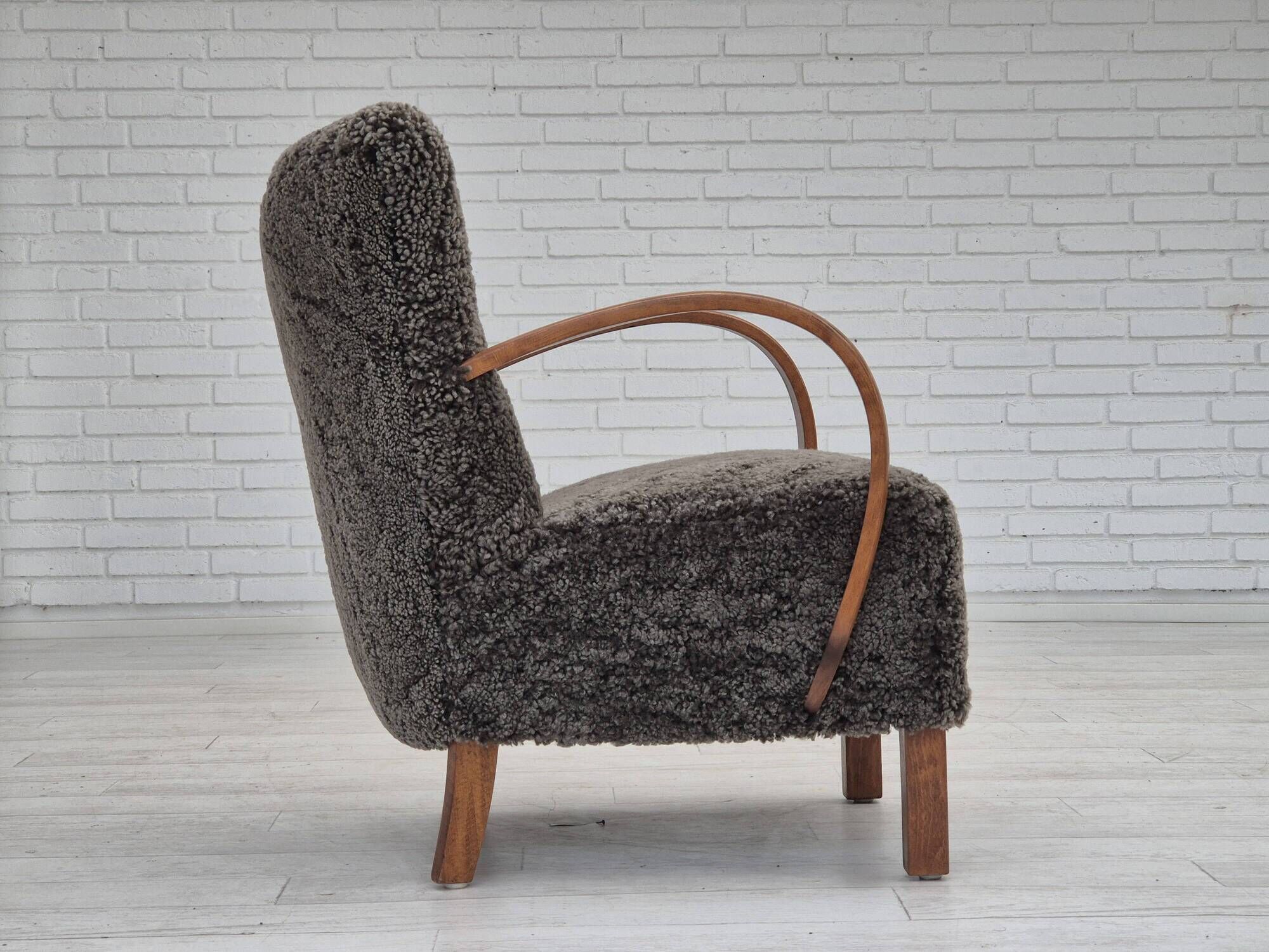 1960s, completely reupholstered Danish art deco armchair, genuine sheepskin "Wellington".