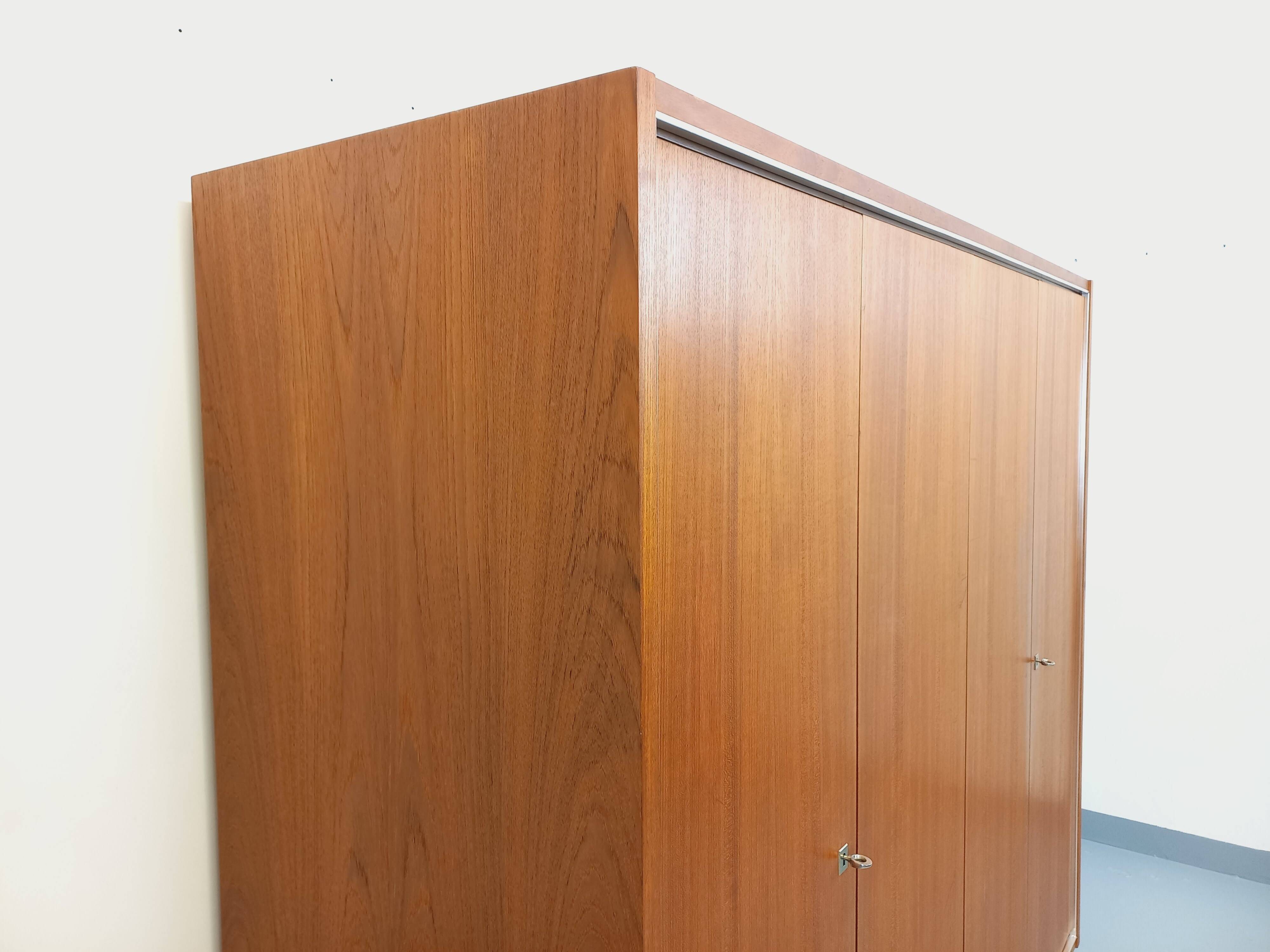 Vintage Scandinavian modernist wardrobe in teak and metal from the 1960s.