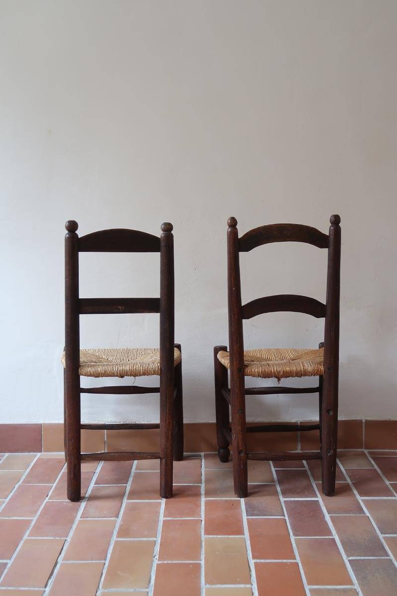Pair of straw farm chairs