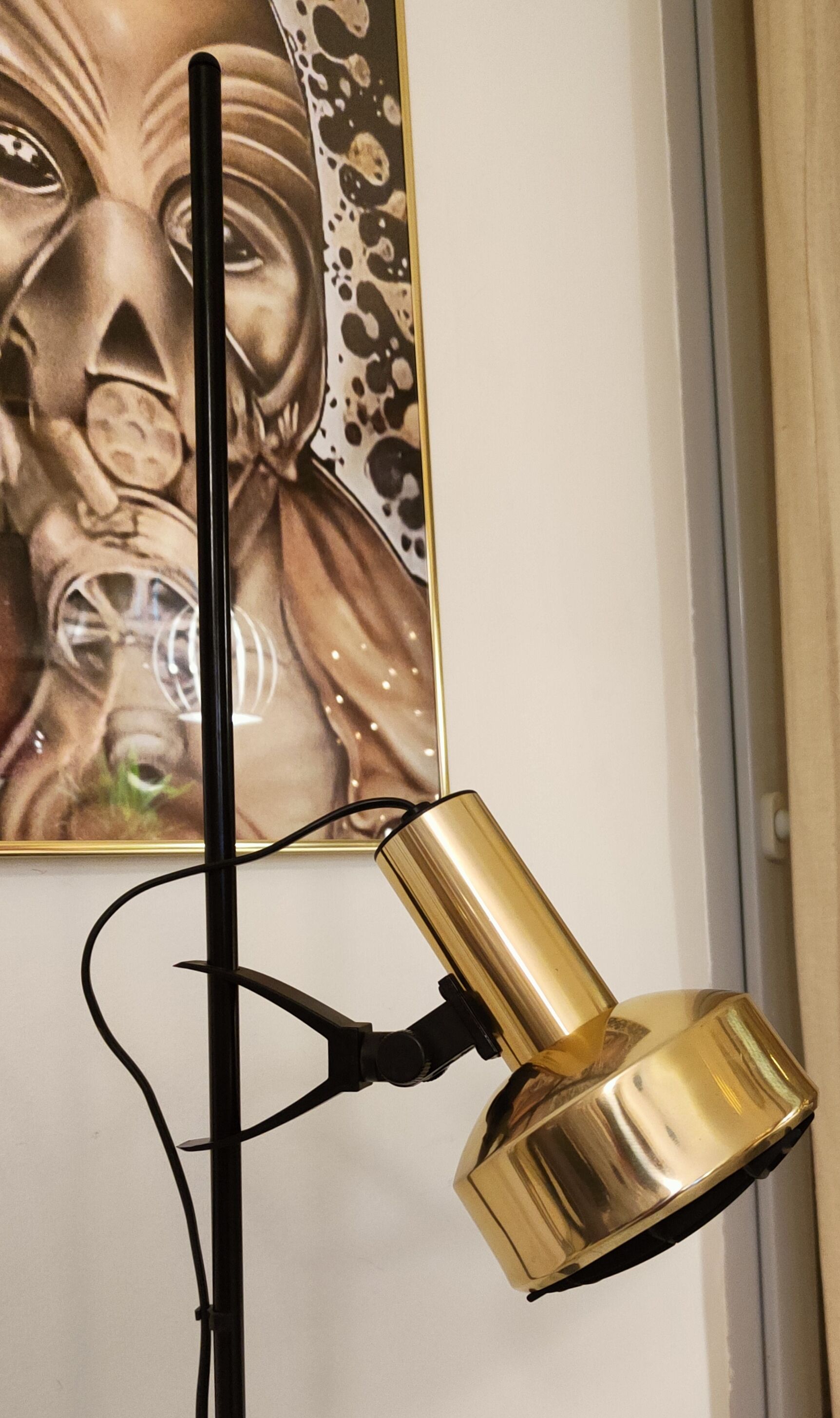 Black floor lamp is gold vintage 1980