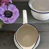 Old white enameled pitcher