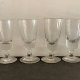 12 old glasses on foot at bistro or absinthe