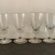 12 old glasses on foot at bistro or absinthe