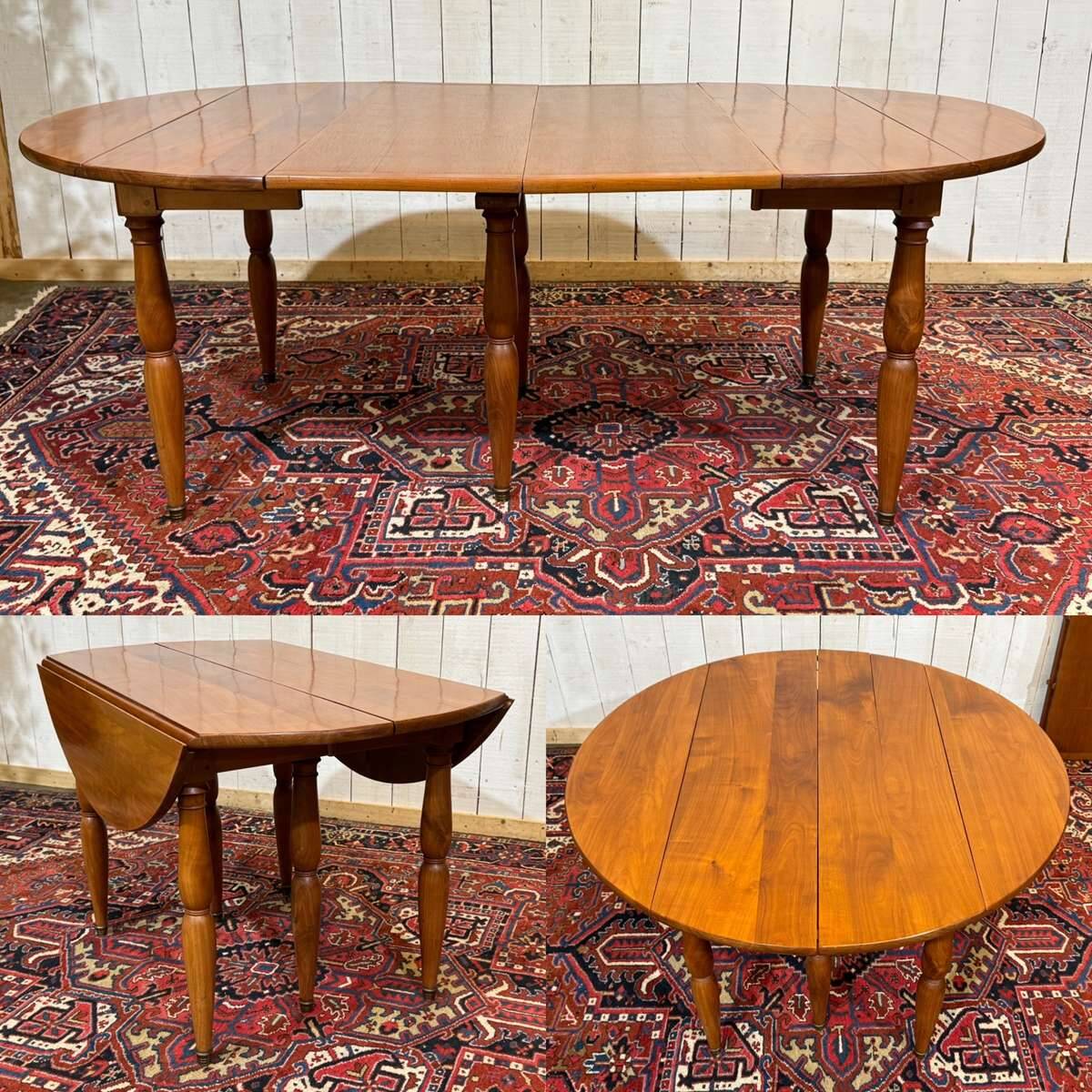 Round cherry wood table, 6 feet, Louis Philippe style with 2 extensions.