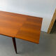 Rectangular extendable dining table with Scandinavian design in teak.