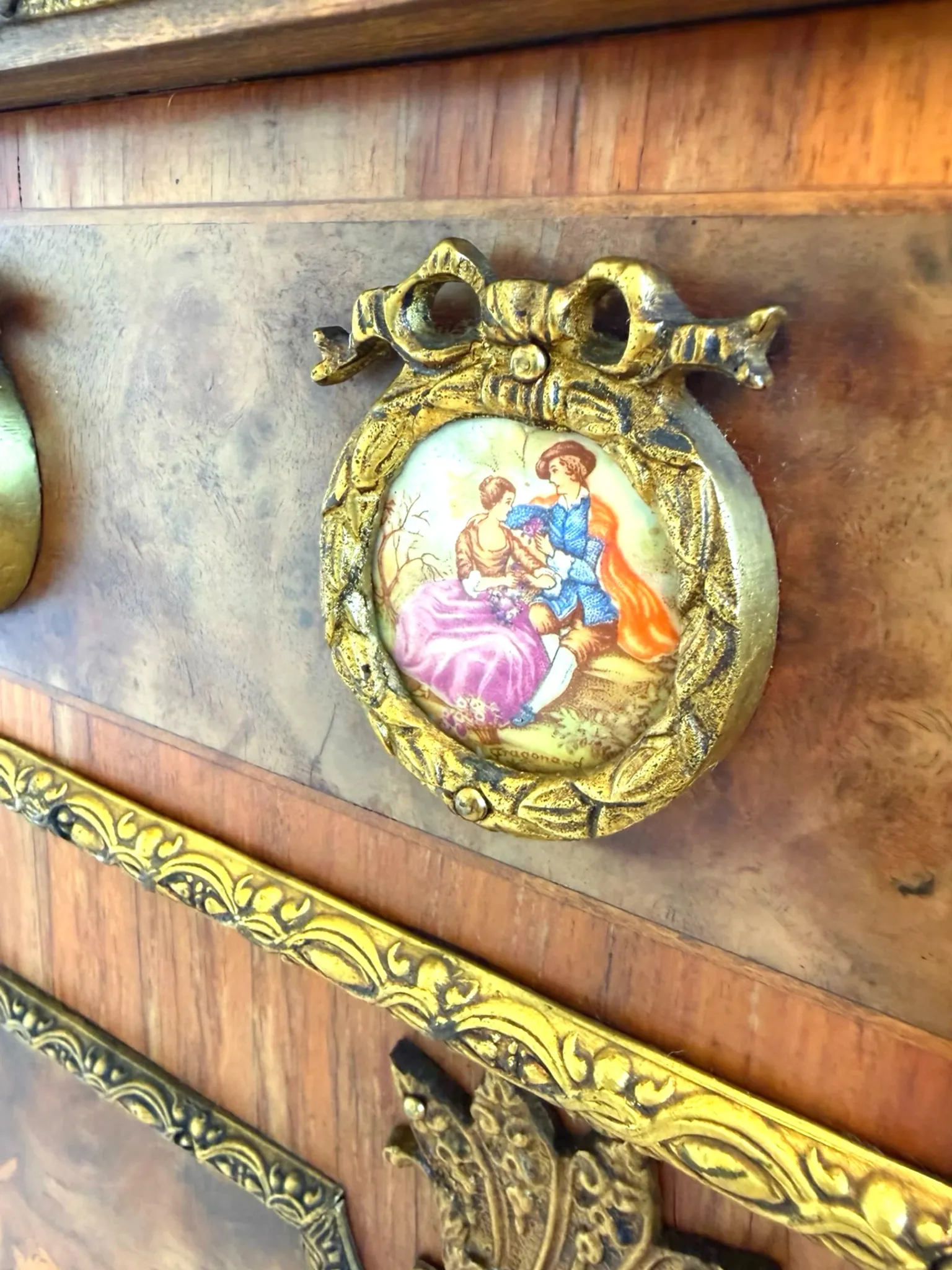 An antique French Louis XVI-style marble-top side cabinet