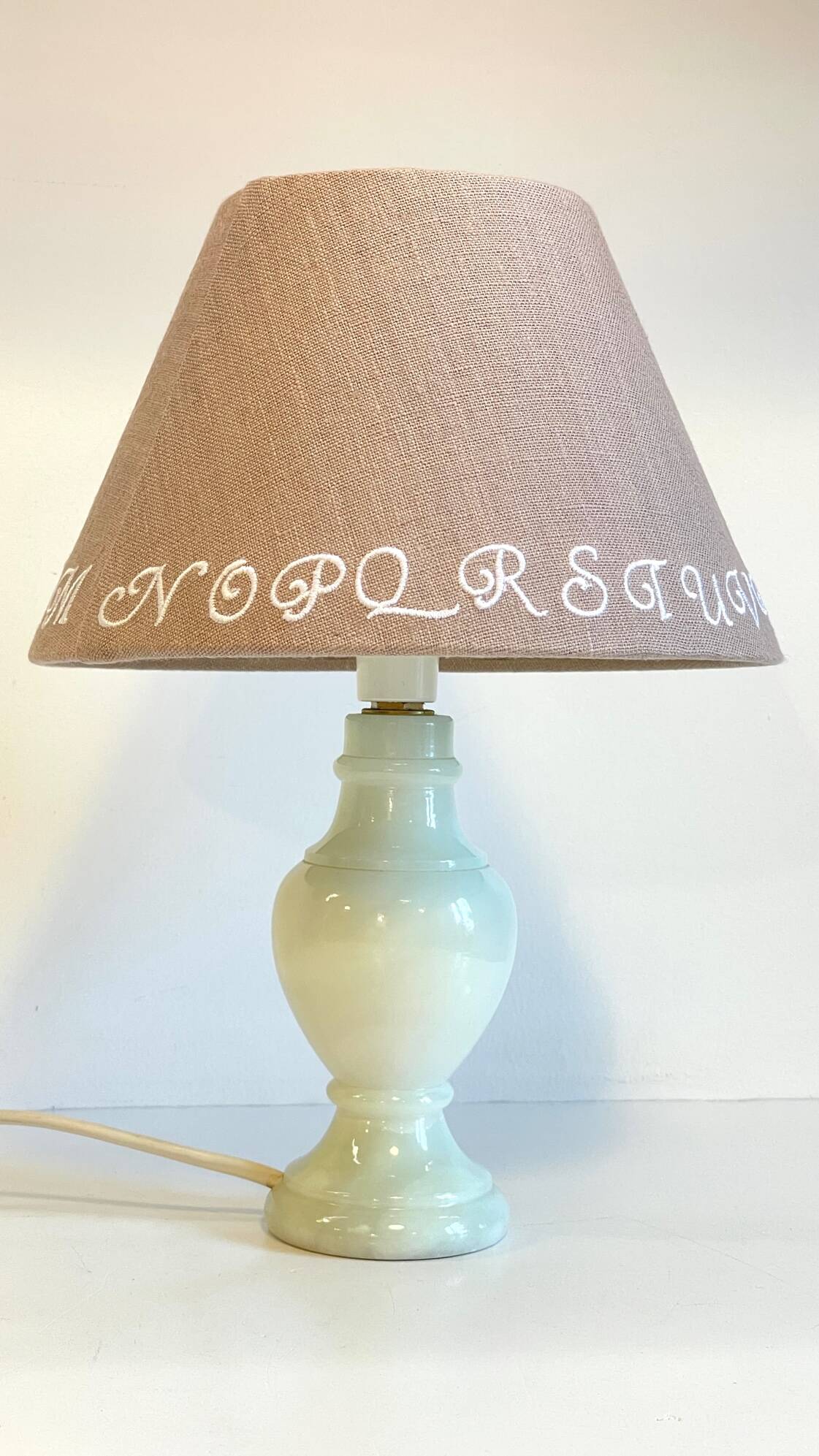 White marble lamp and vintage linen