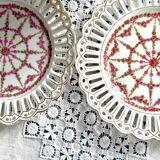 Pair of openwork porcelain plates decorated with roses