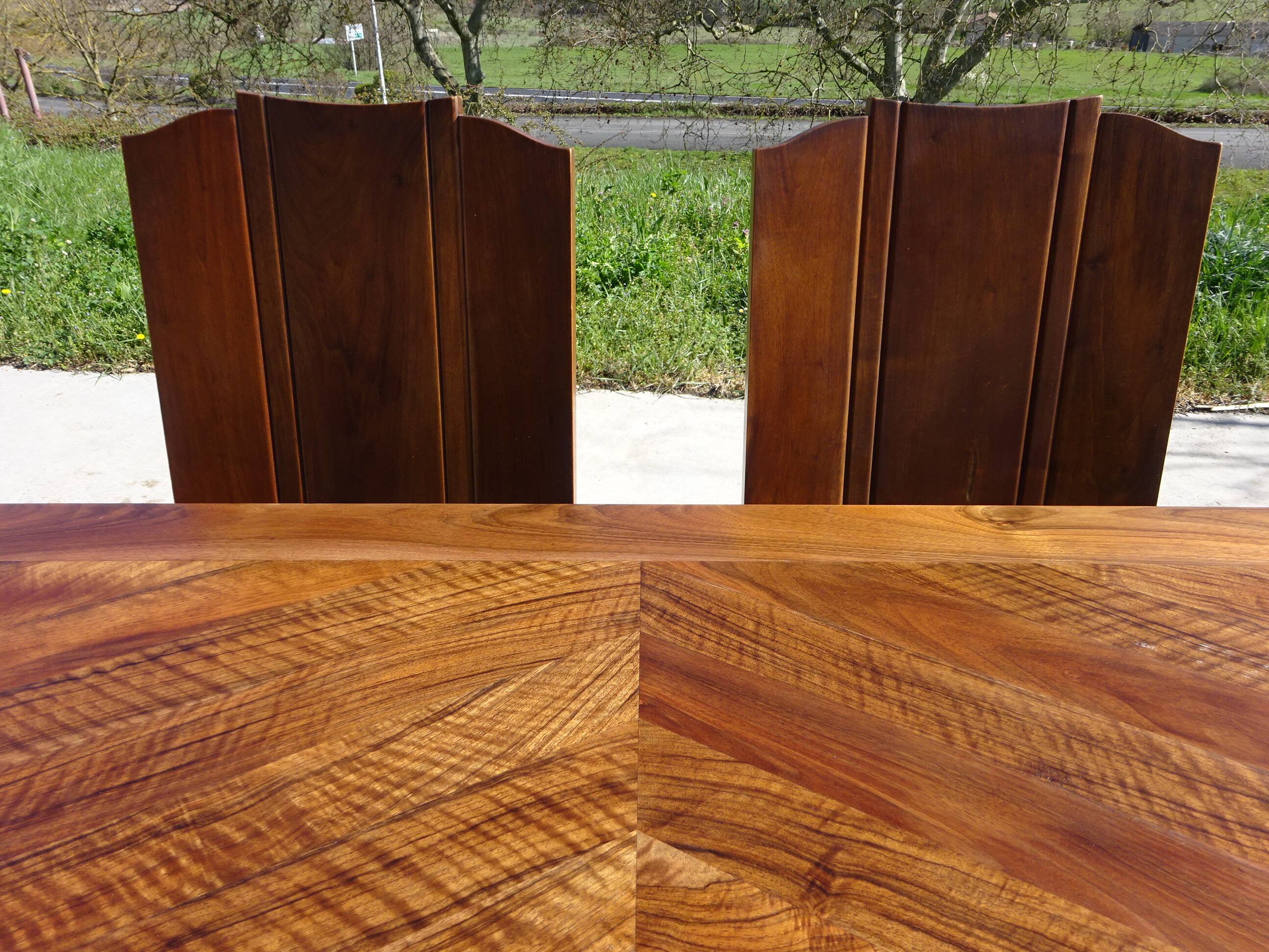 Antique solid walnut table with marquetry and extensions.