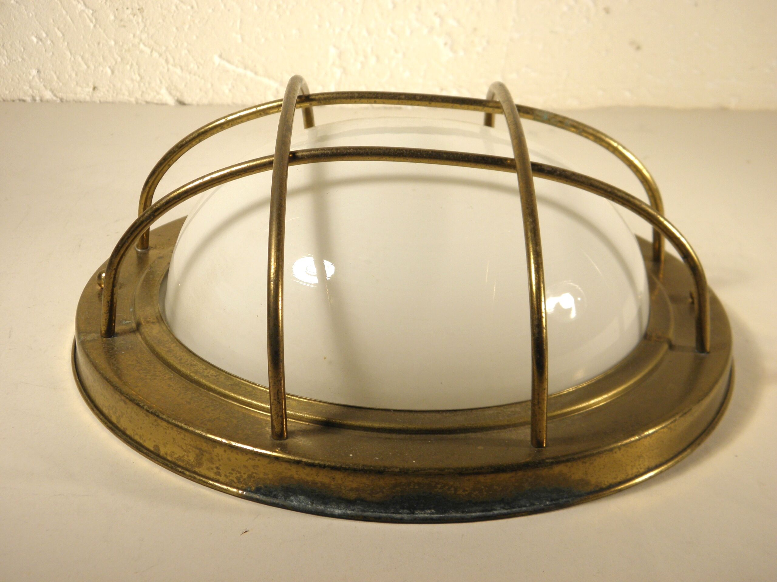 Brass "porthole" wall lamp