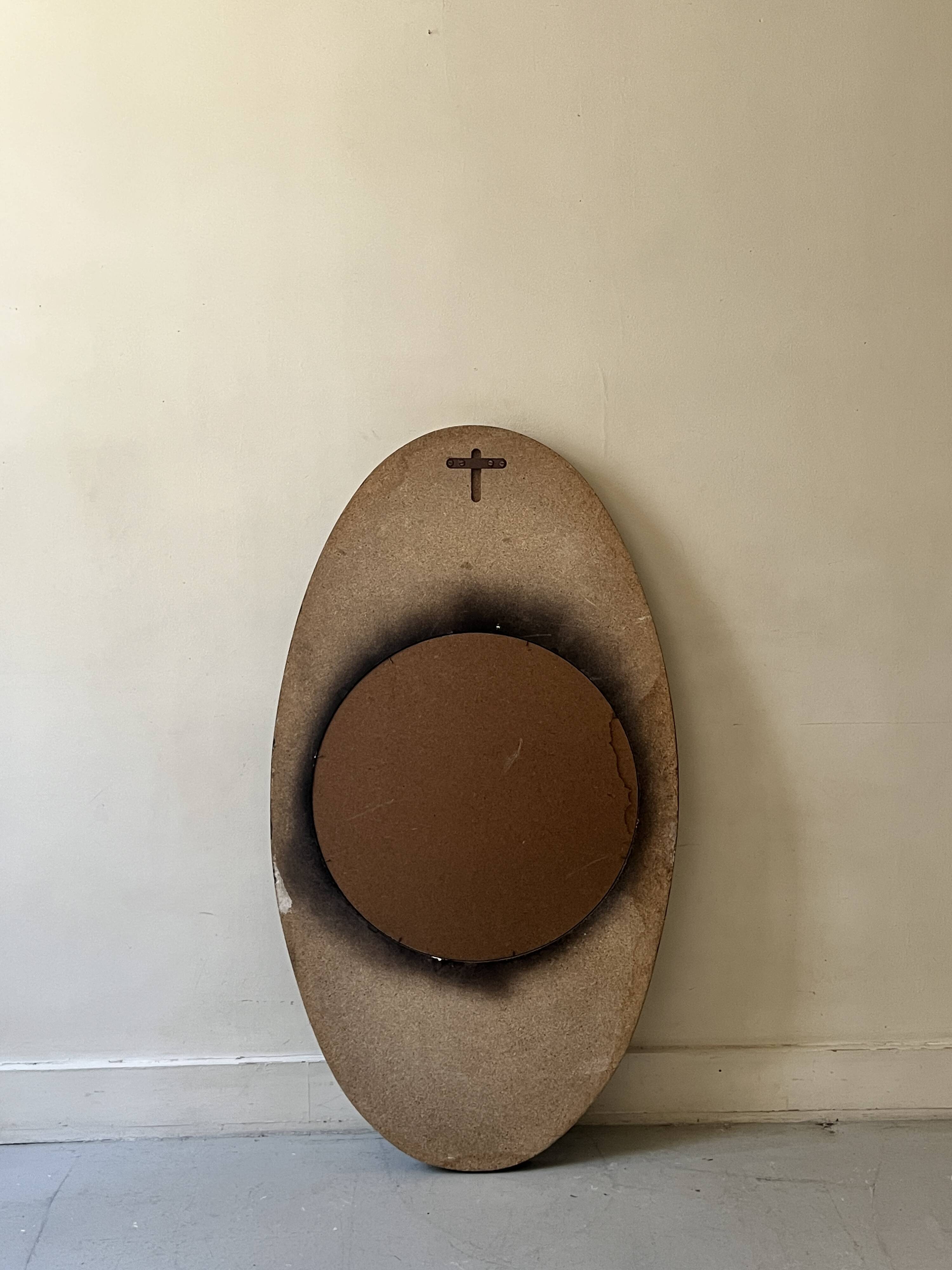 Large oval Italian mirror, modernist, space age design from the 1970s.