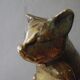 Chat en laiton