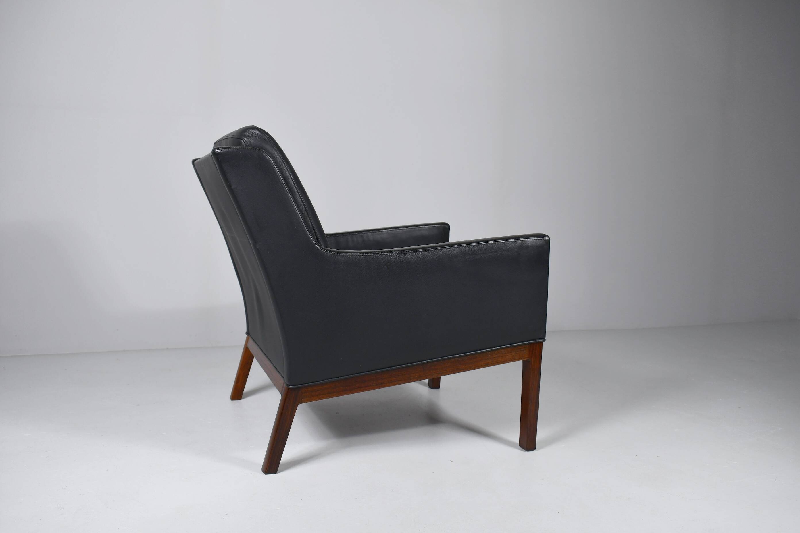 Leather and rosewood armchair by Kai lyngfeldt-Larsen. Denmark