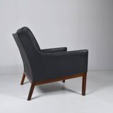 Leather and rosewood armchair by Kai lyngfeldt-Larsen. Denmark