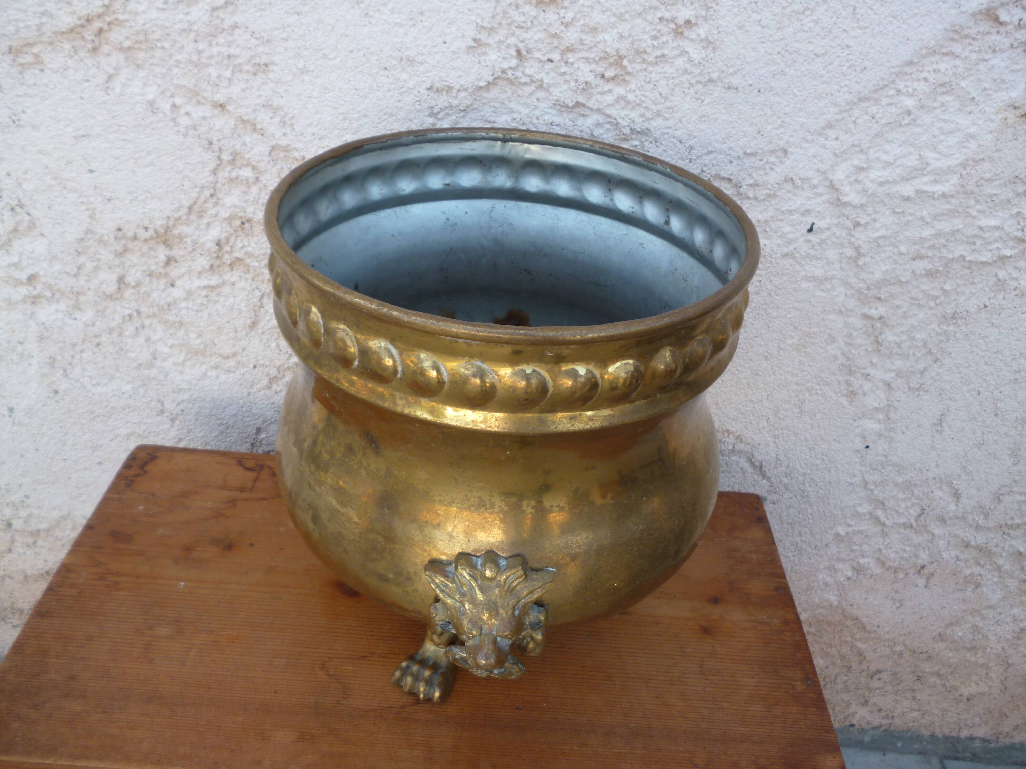 Antique lion heads brass pot cover