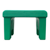 Postmodern plastic stool with a wood effect.