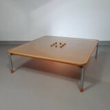 Rare coffee table 110 x 110 x height 35 cm with 8 flange wooden / cork caps in the glass top.