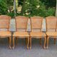 4 Louis XV dining chairs in light solid oak with caning.