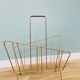 Asymmetrical gold metal magazine rack – 1960s