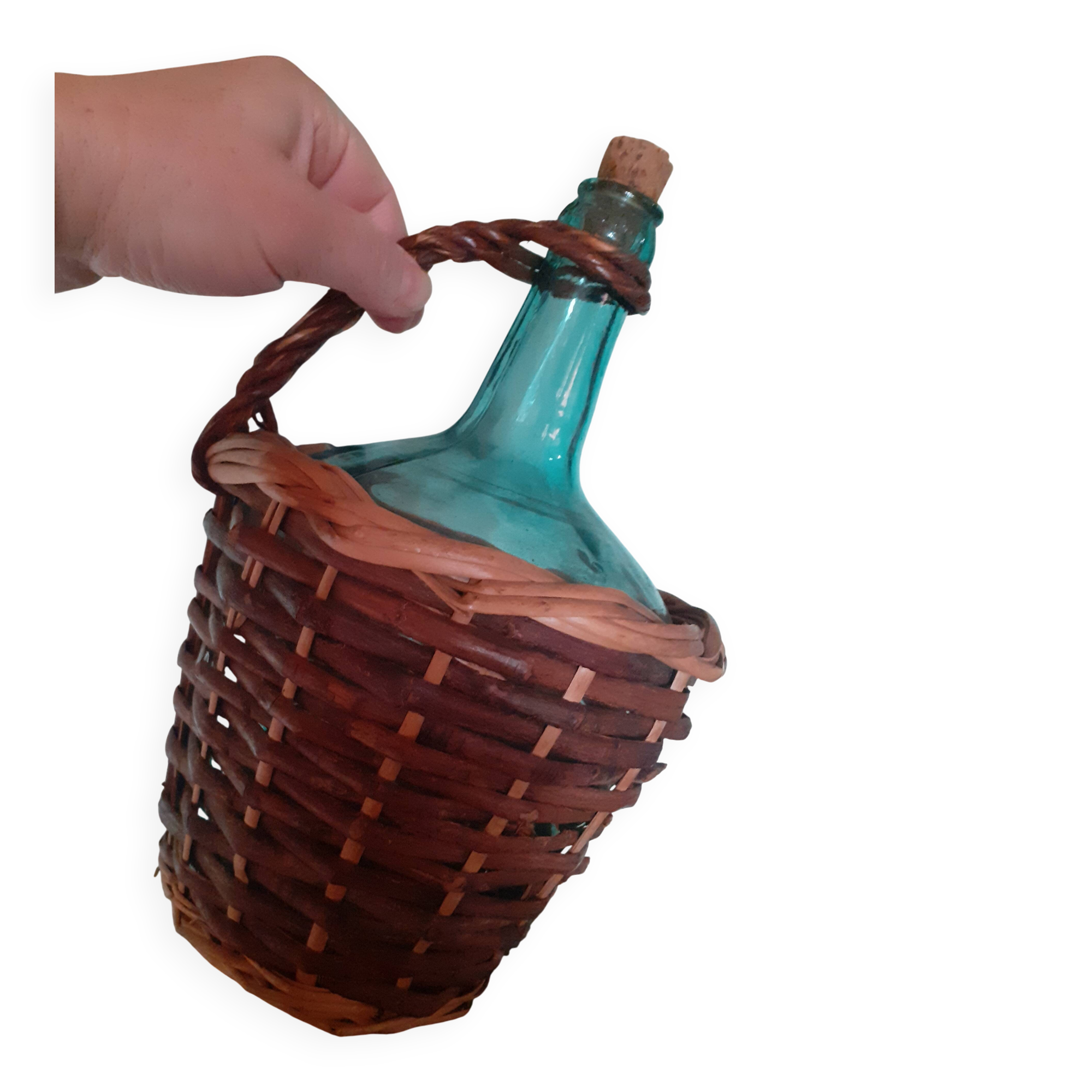 Glass bottle in its wicker dress