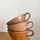 Three antique stoneware cups