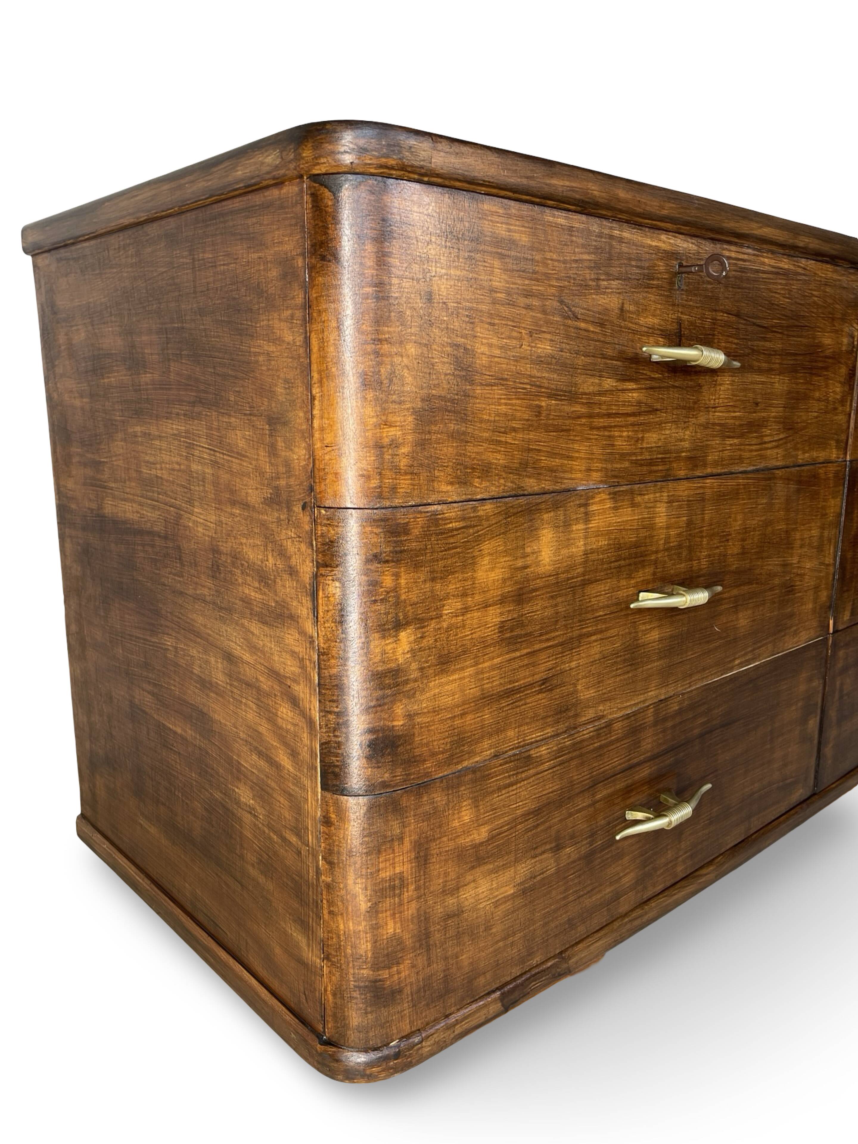A vintage Italian chest of drawers, made of veneered walnut and solid wood,