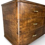 A vintage Italian chest of drawers, made of veneered walnut and solid wood,