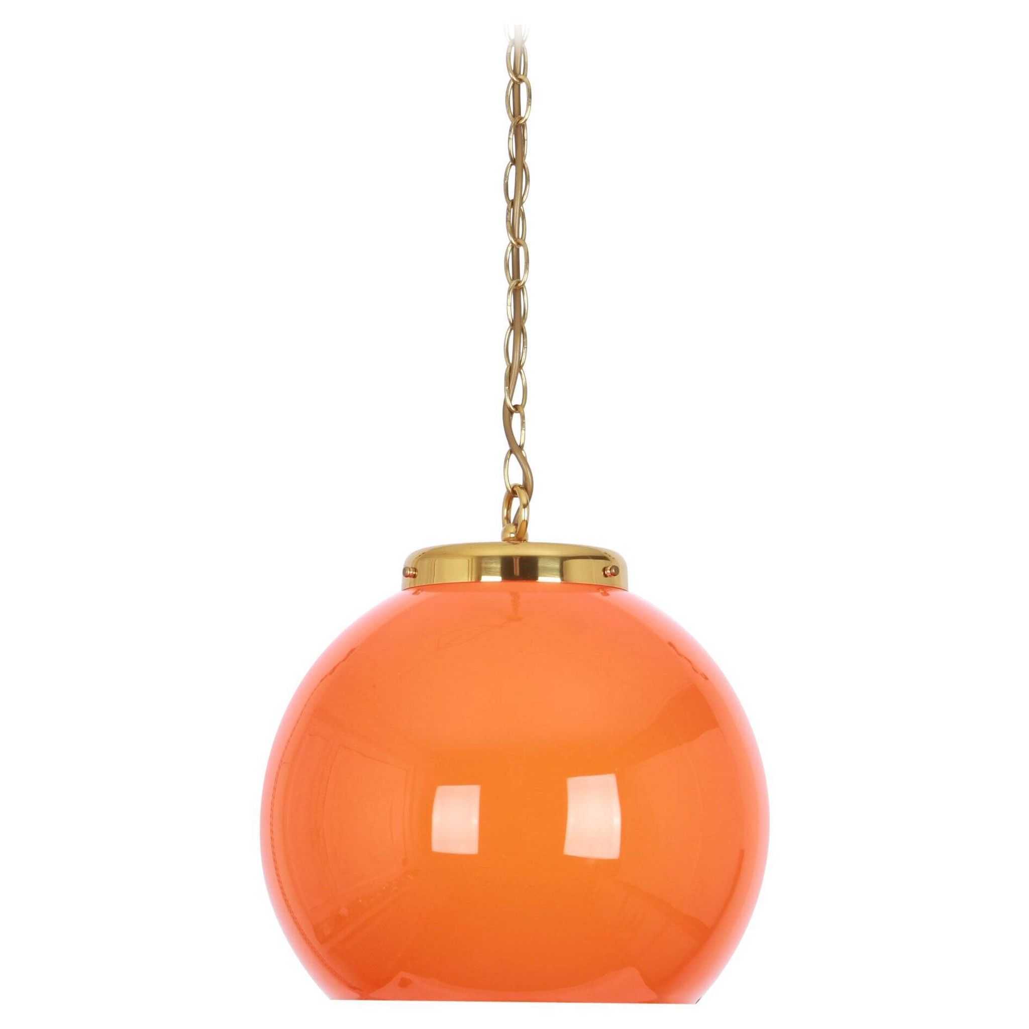 Orange glass pendant light by Peill Putzler, Germany, 1970.
