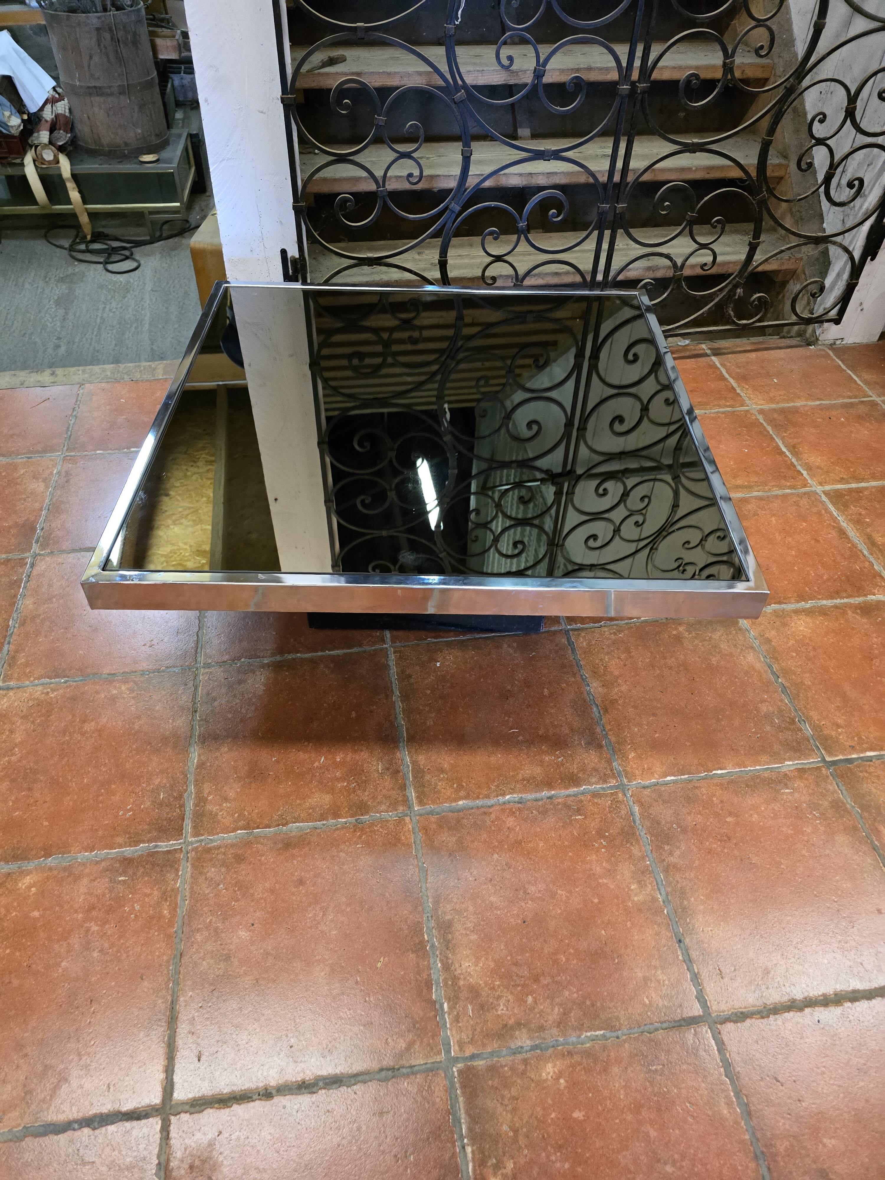 Chrome coffee table with smoked mirror top