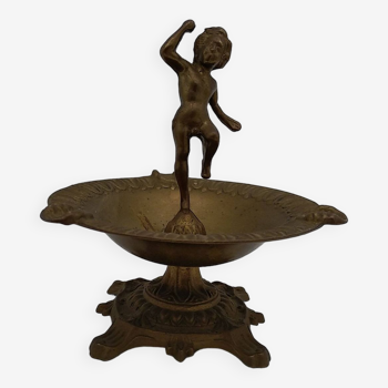 Brass ashtray with cherub decoration.