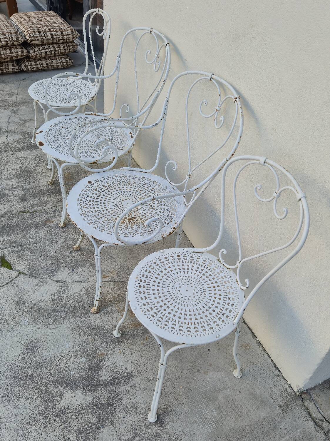 Garden furniture, two armchairs and two wrought iron chairs, period 1
