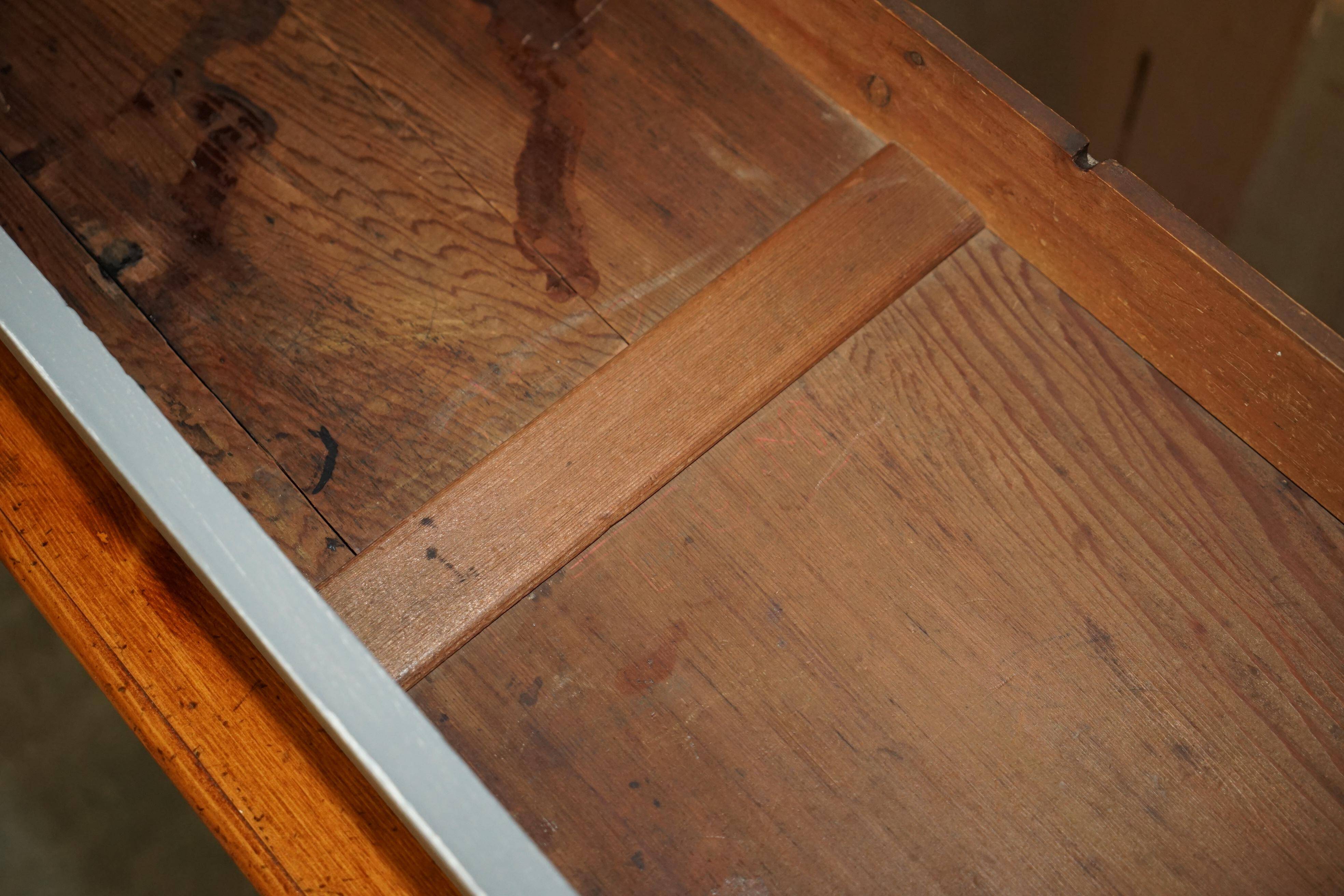 Vintage wooden furniture for 45 wine bottles with a drawer.