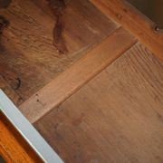 Vintage wooden furniture for 45 wine bottles with a drawer.