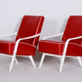 Red Leather mid Century Armchairs made in 1950s Czechia. Restored beech.