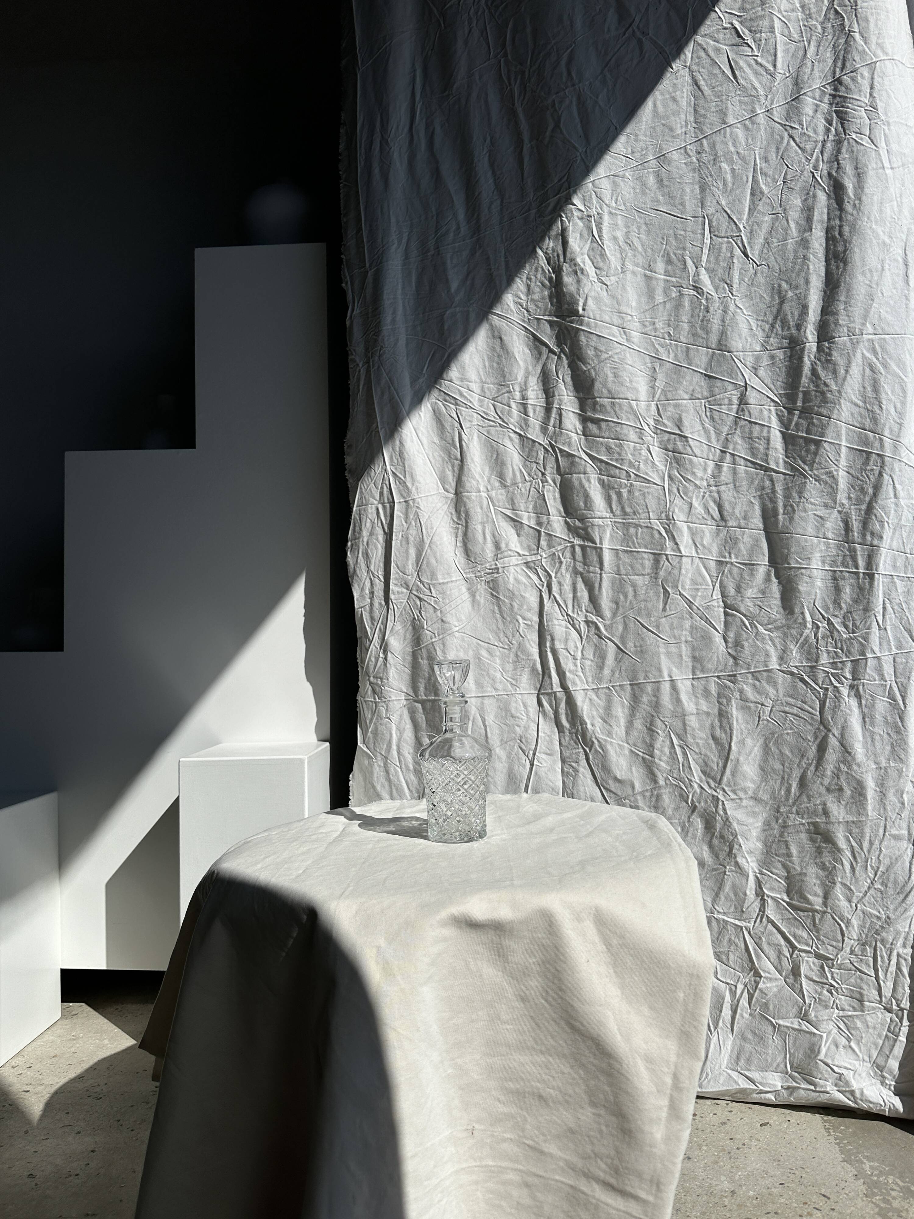 Small cylindrical glass whiskey decanter H:23