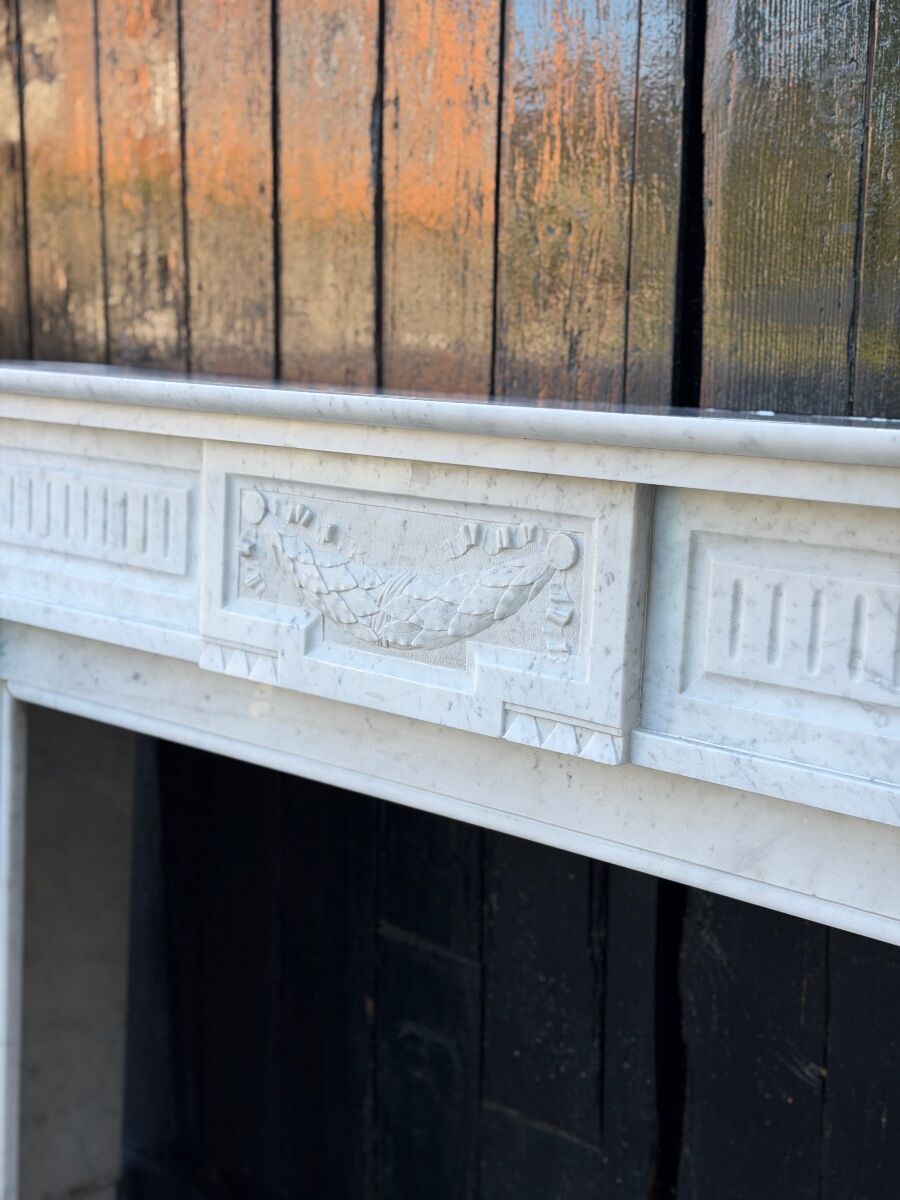 Louis XVI style fireplace in white Carrara marble, circa 1880.