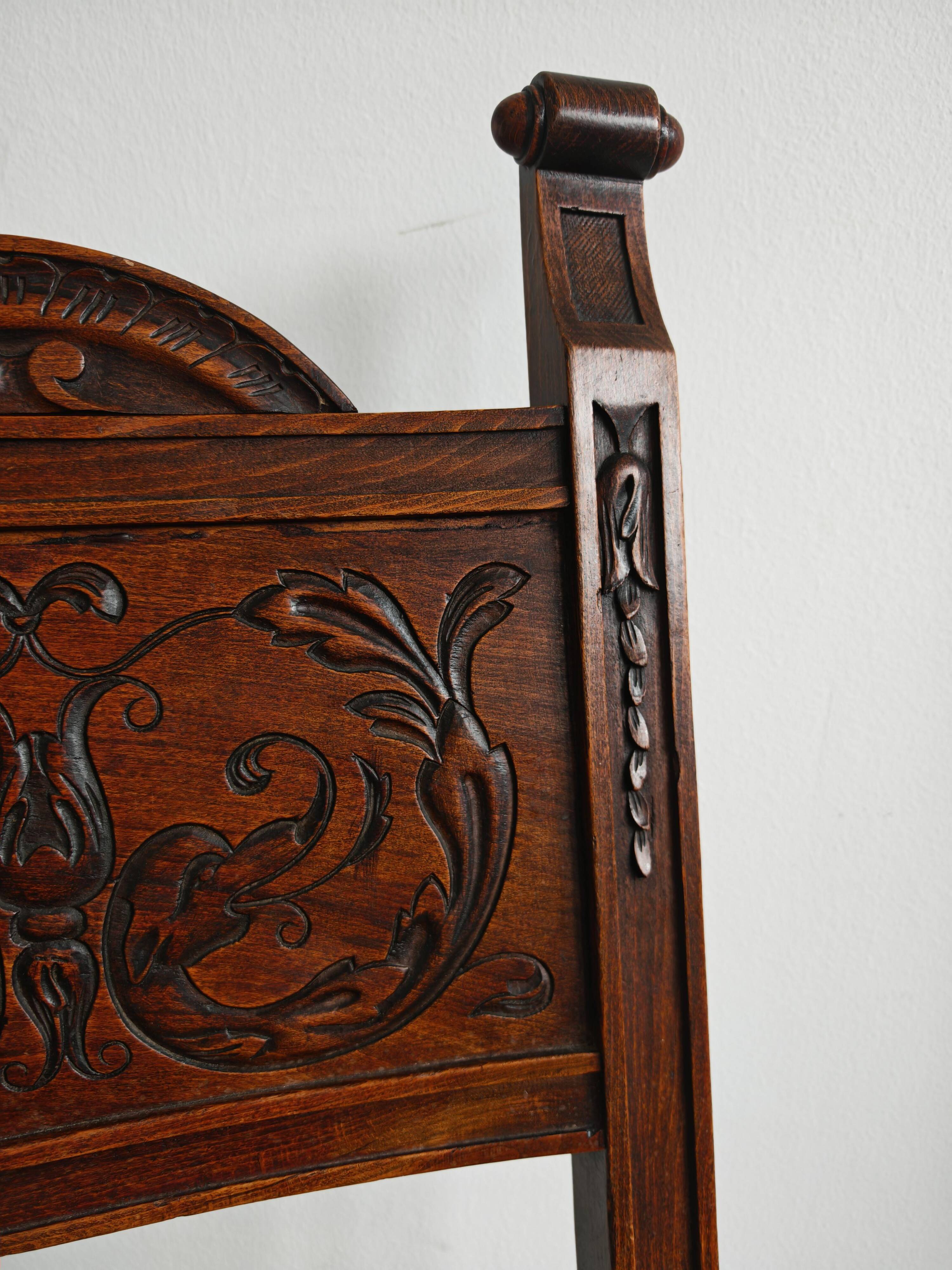 Pair of Neo-Renaissance oak chairs with straw seats, 1910