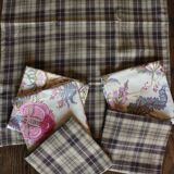 6 brown checkered table napkins with vintage flowers