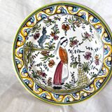 Decorative plate with medieval, Breton and rabbit decoration surrounded by plants - Breton earthenware