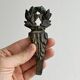 Antique black patinated metal coat hook.