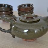 Antique stoneware teapot and its six signed bowls