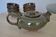 Antique stoneware teapot and its six signed bowls